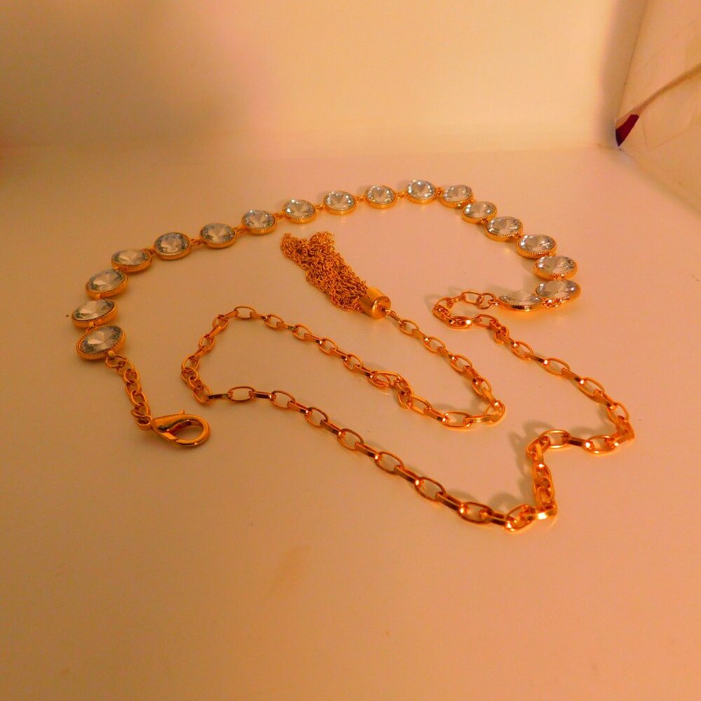 GOLD TONE AND RHINESTONE BELT. 46" LONG